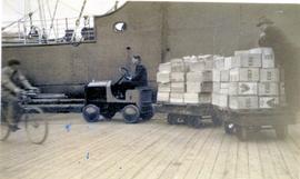 Loading apples on the wharf