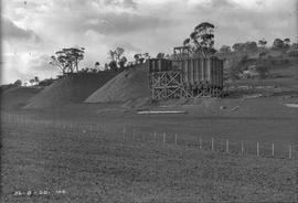 Stockpiles of rock and framework of new building