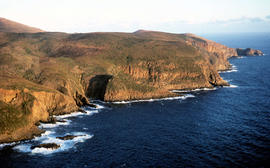 Setting sun shines on headland east of Cloudy Bay