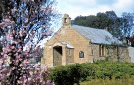 Sandstone church building in late winter