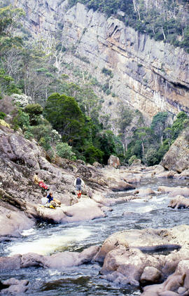 Sitting on ledge beside Leven River