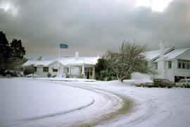 Snow covers cars at Tarraleah Chalet