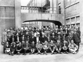 Posing for formal photograph outside Cadbury factory