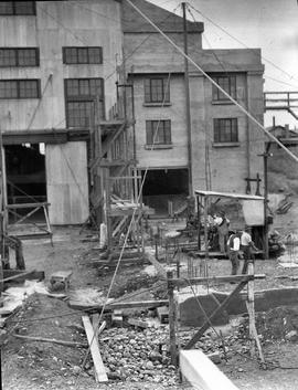 Workmen preparing footings for expansion at E.Z. Co. Zinc Works at Risdon