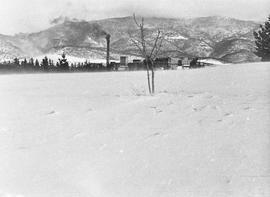 Snow covered ground with Cadbury Factory in background