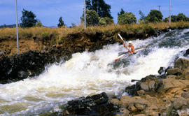 Paddler on whitewater course at Bradys Lake