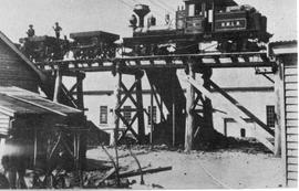 View of steam train on trestle bridge likely at the smelting works, Crotty, Tasmania.