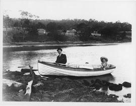 Man and small child in a rowboat